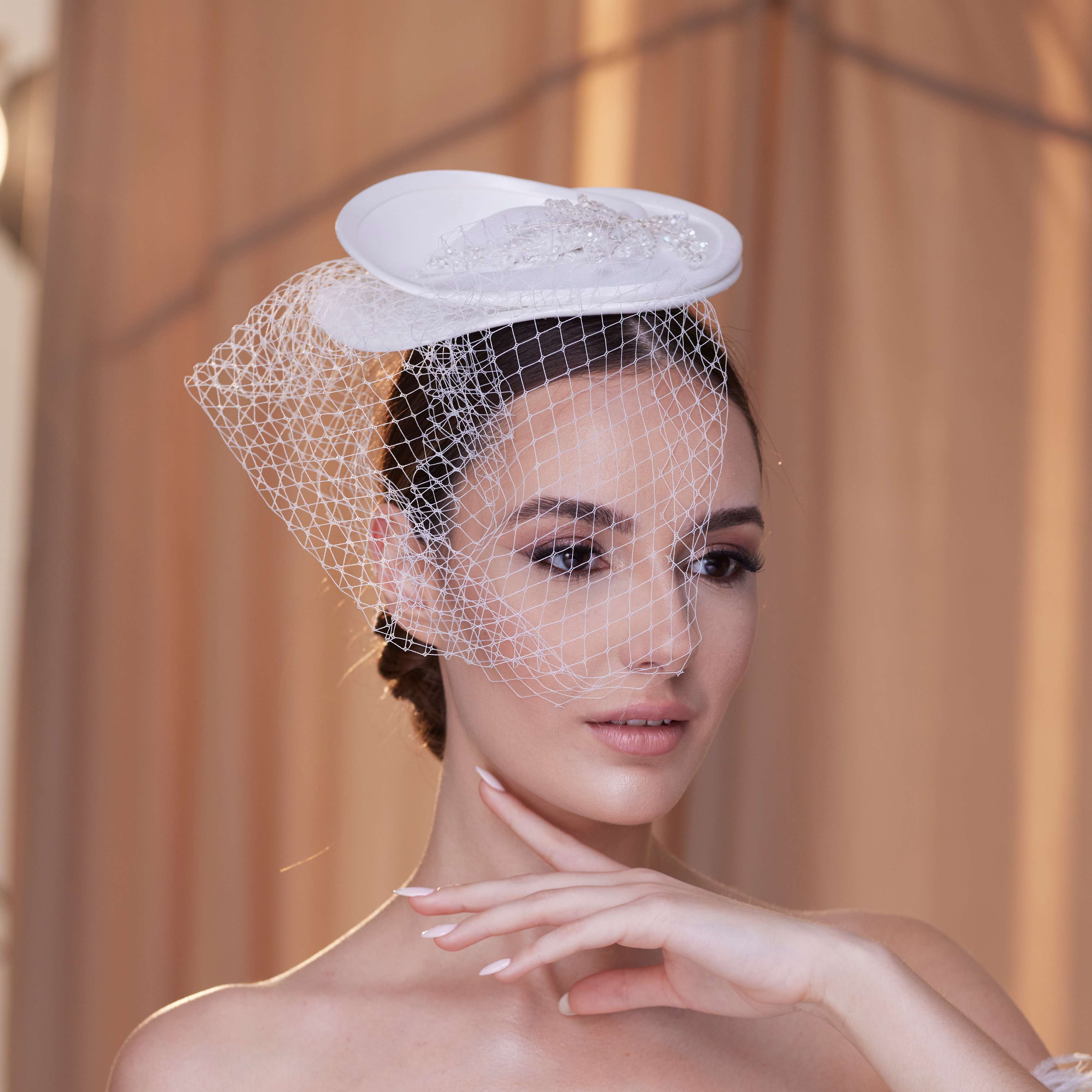 Elegant Bridal Fascinator with Beaded Details and Birdcage Veil