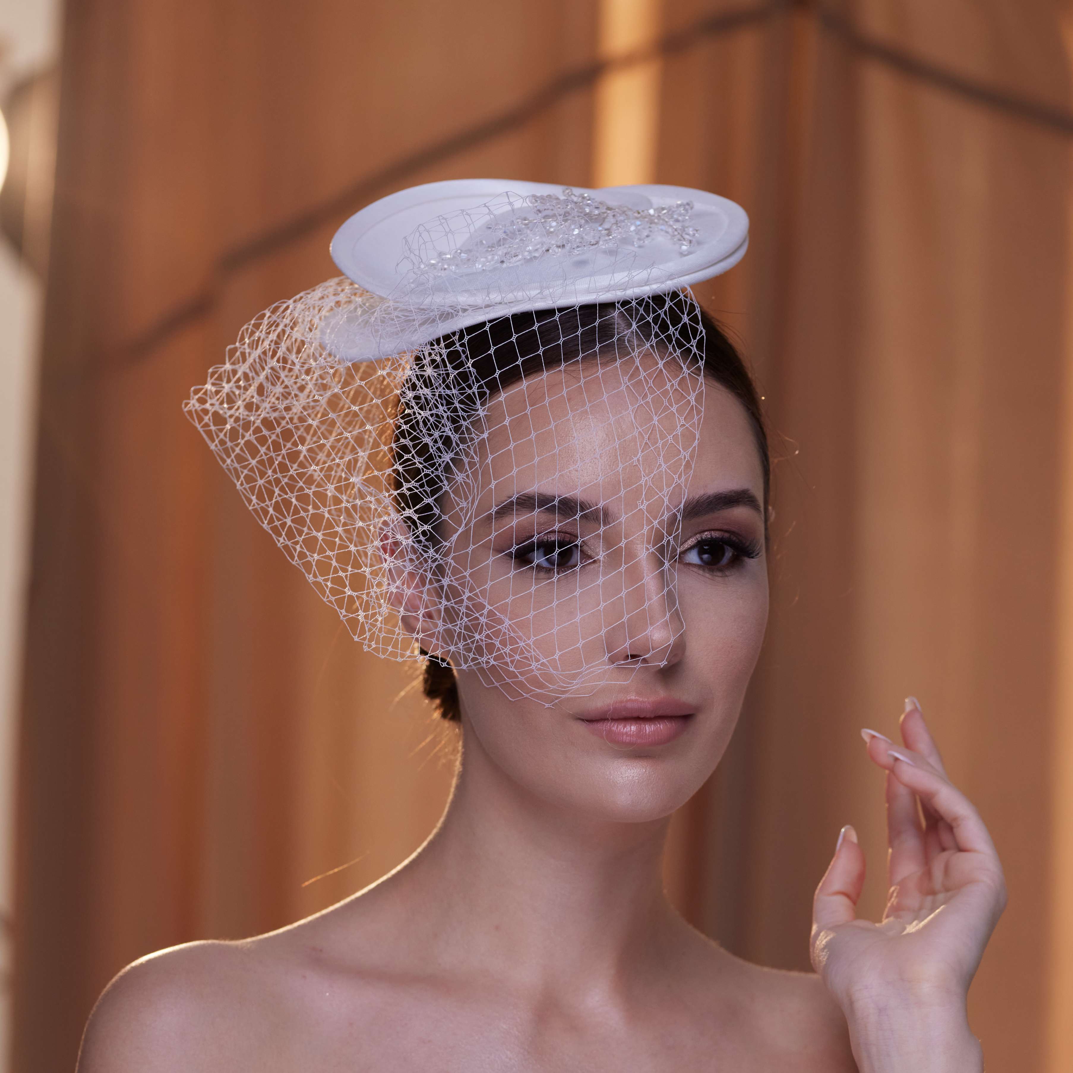 Elegant Bridal Fascinator with Beaded Details and Birdcage Veil