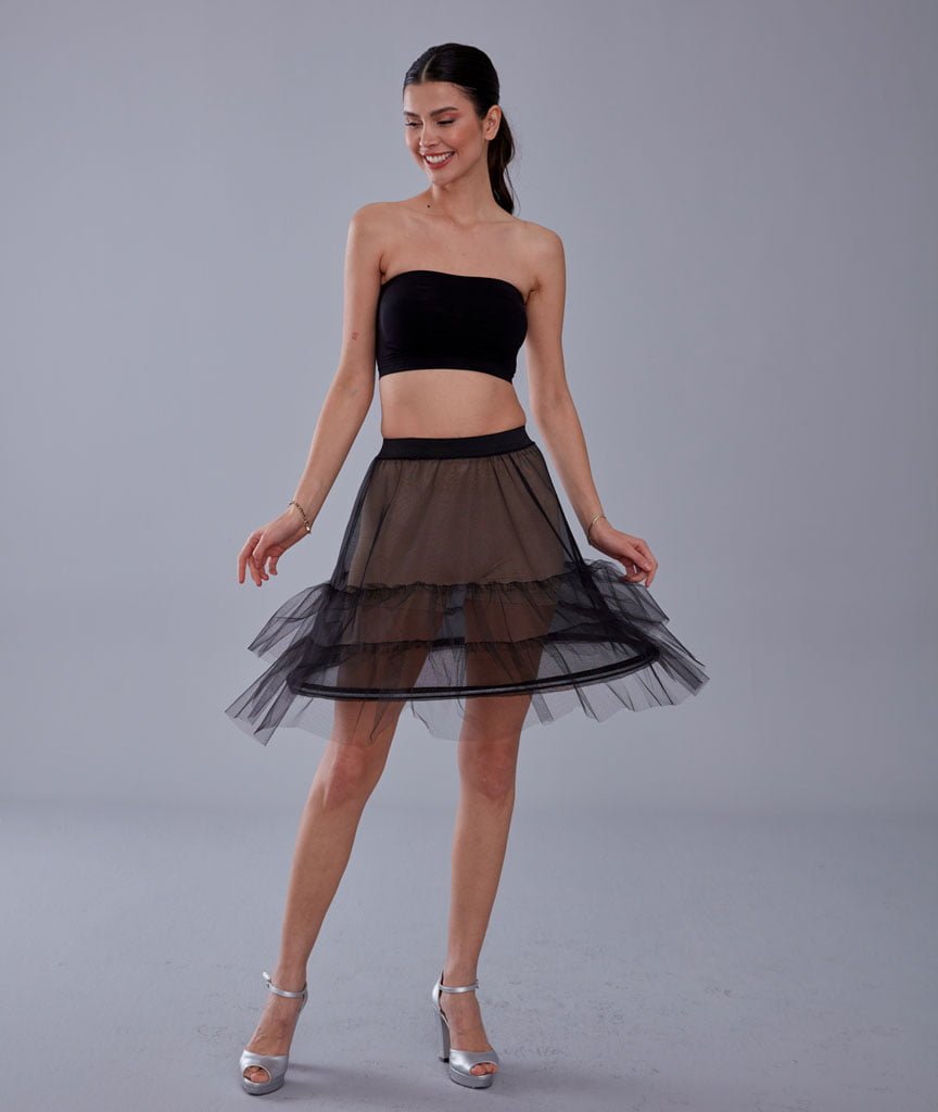 Structured short hoop skirt worn under evening dress