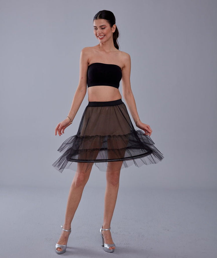 Structured short hoop skirt worn under evening dress